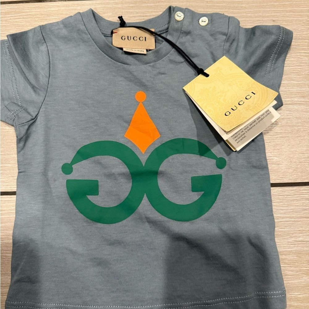 Brand new with tags Gucci Kids Blue Tee with Green and Orange Design
